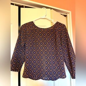 Blue/gold pattern top with cut out slit in back